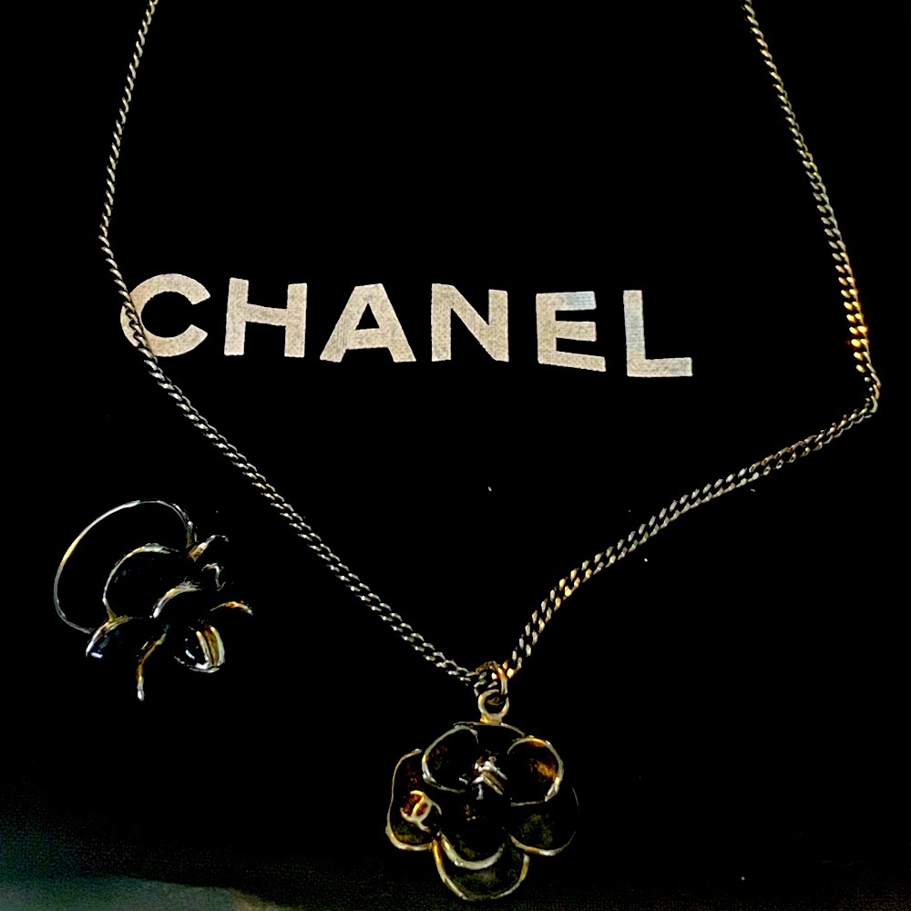 Matching Chanel camellia necklace and ring. Barely worn. Excellent condition.